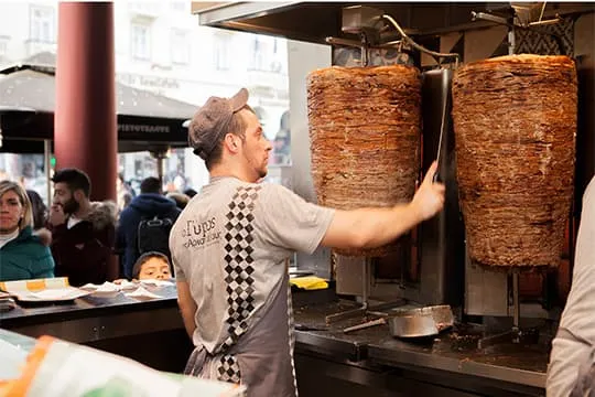 The grill master at the shop's spit